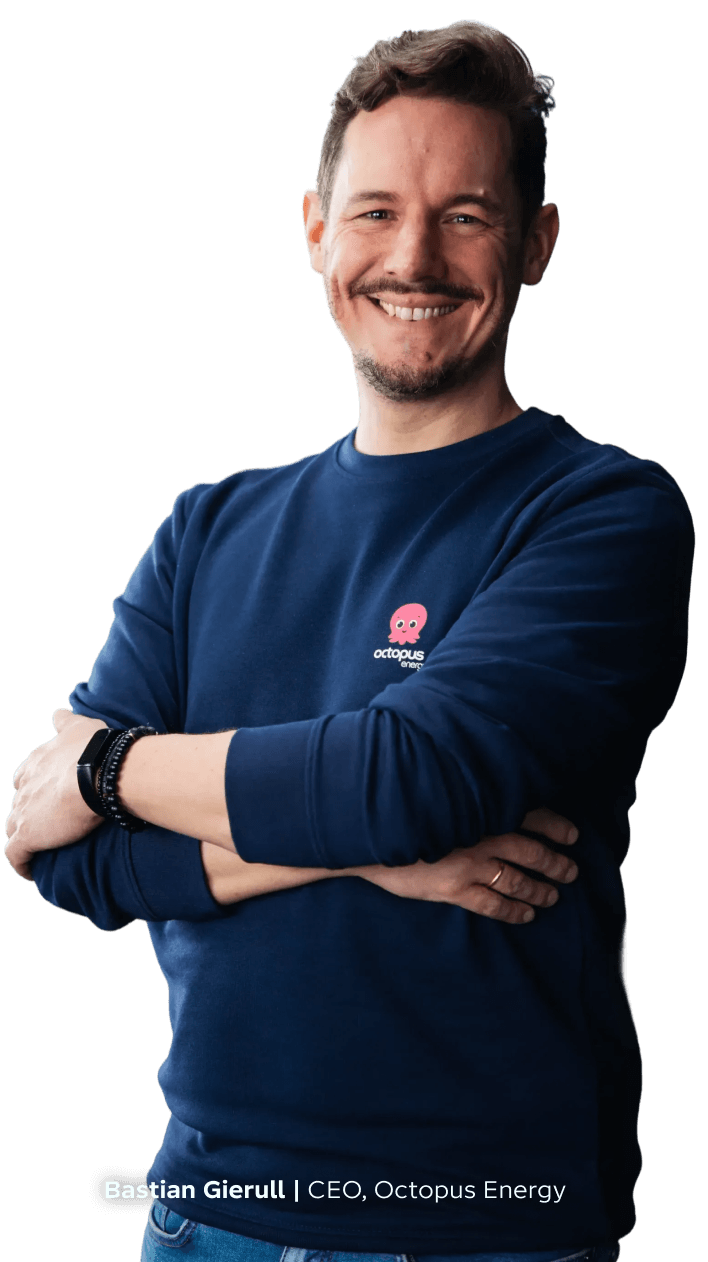 CEO Bastian Gierull with crossed arms wearing a blue Octopus Energy sweatshirt.
