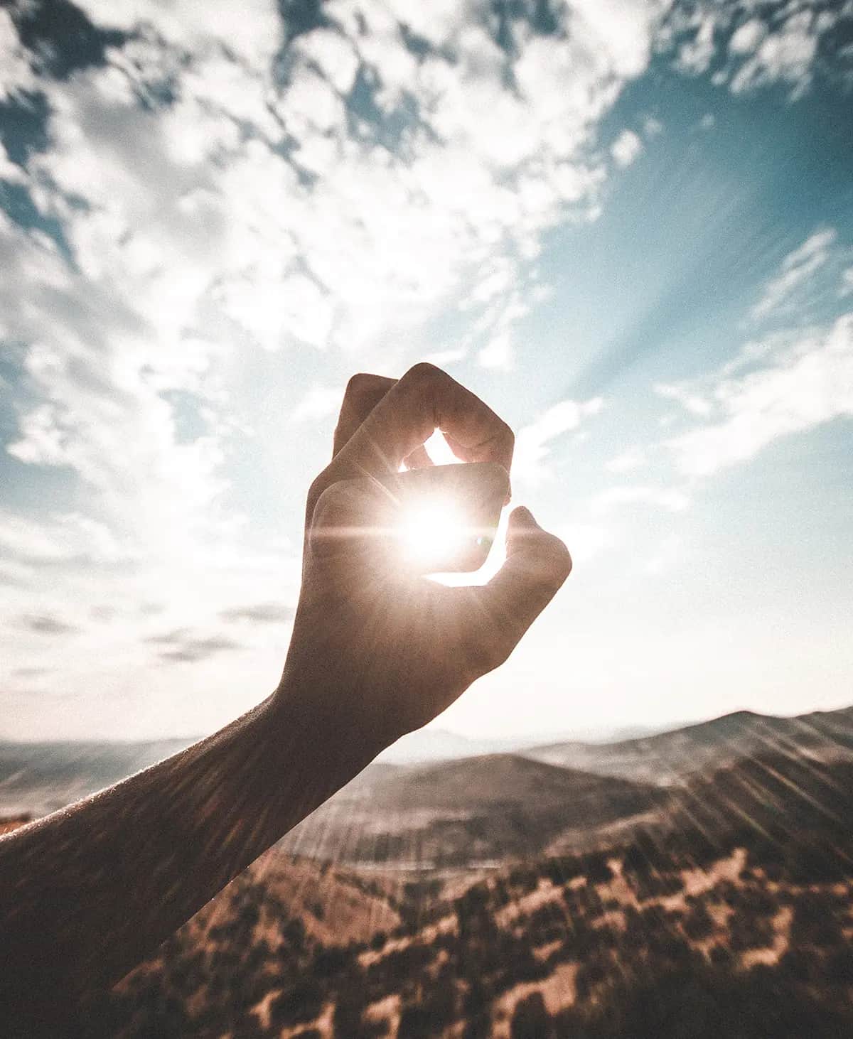Sonne und Hand